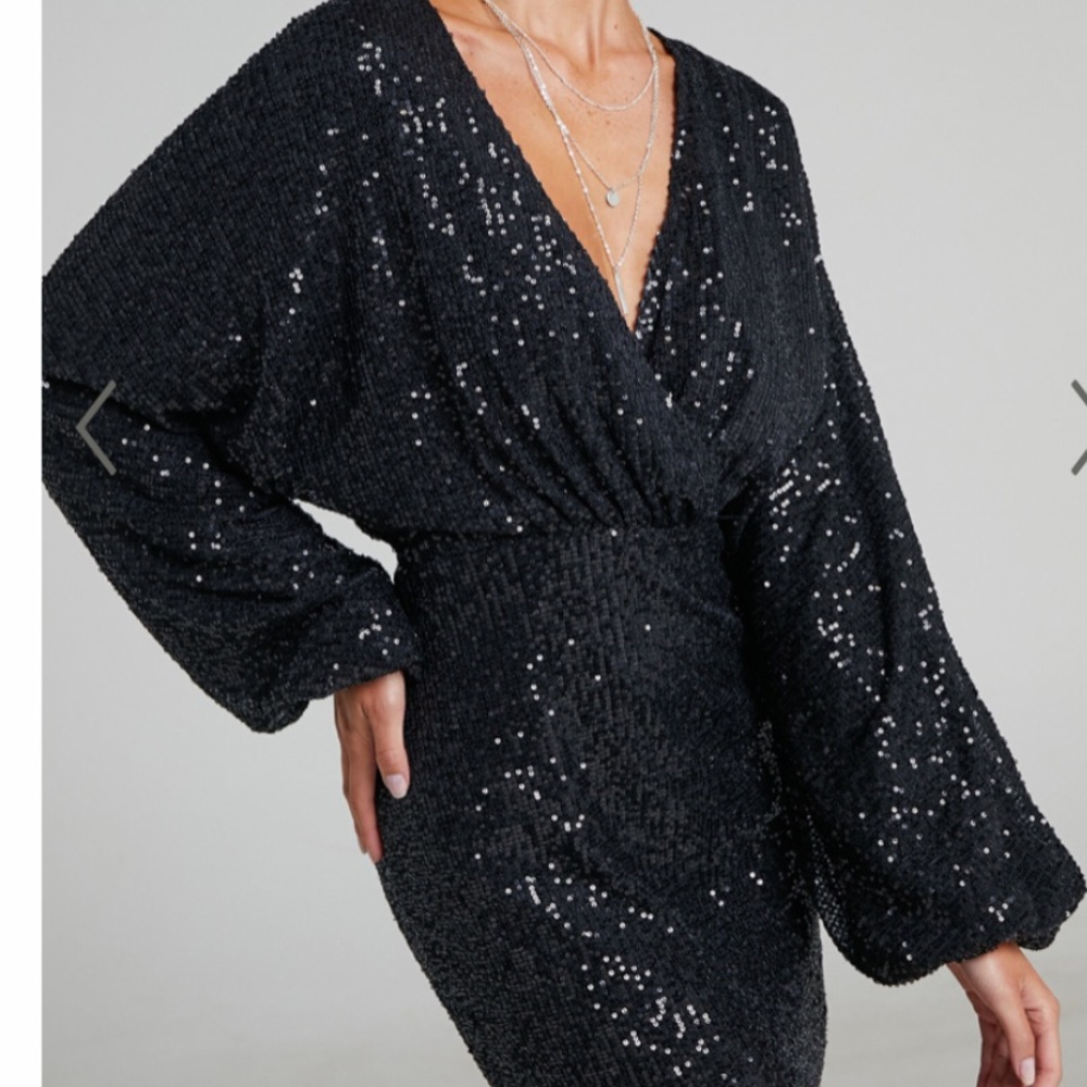 Black sequin mini dress with long bell sleeves